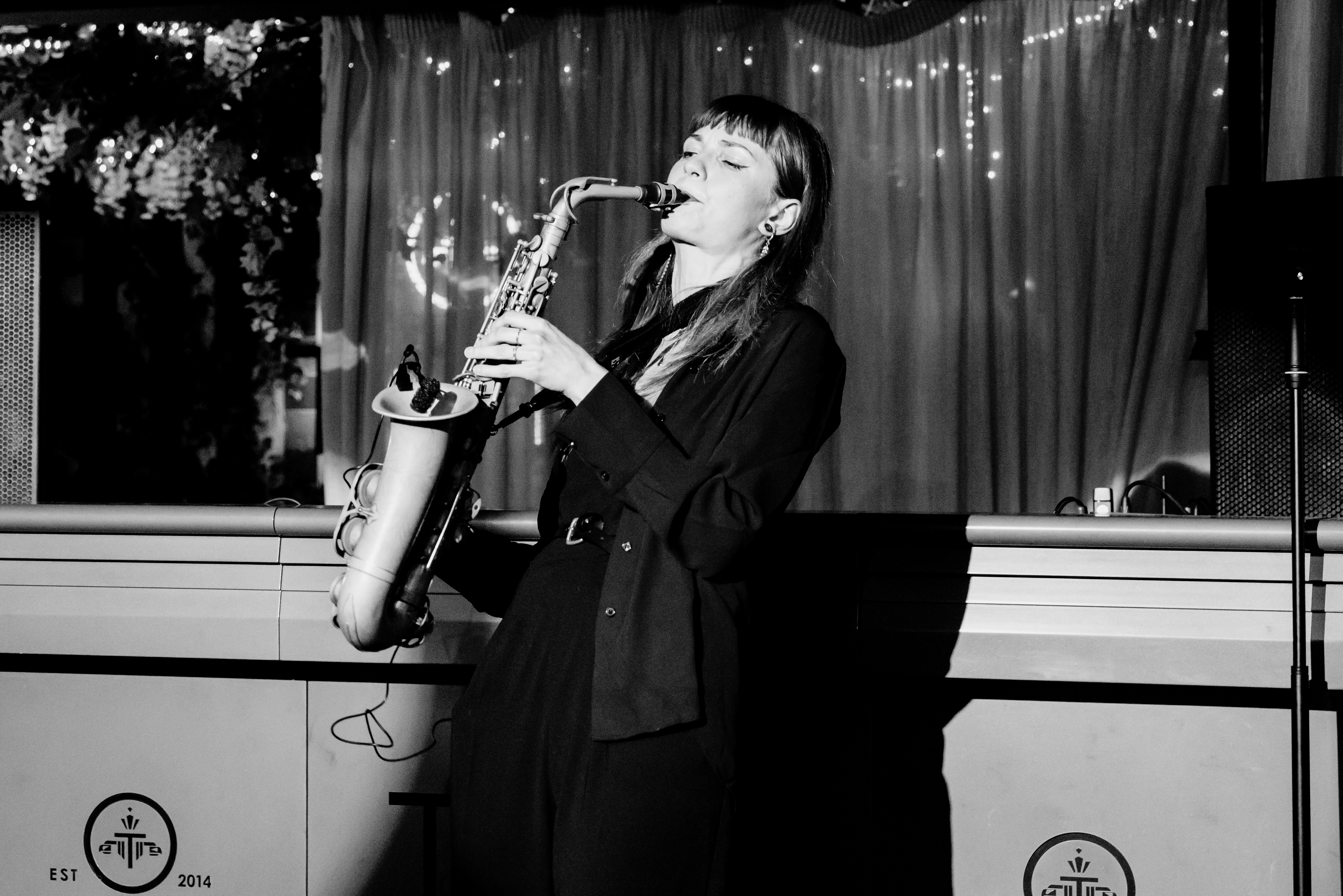 Kristína within an atmospheric nightlife setting